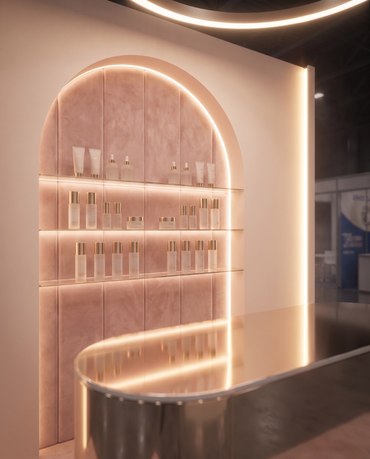 Close-up render of backlit pink arched shelves holding skincare bottles behind a polished gold counter